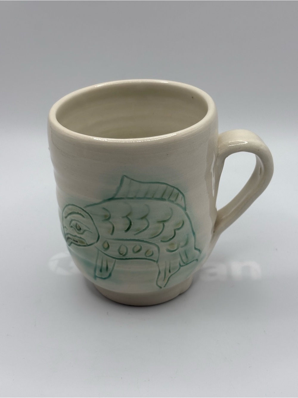 Studio Pottery Artist Signed Mug sea-foam green Indigenous Fish Motif 8 Ozs